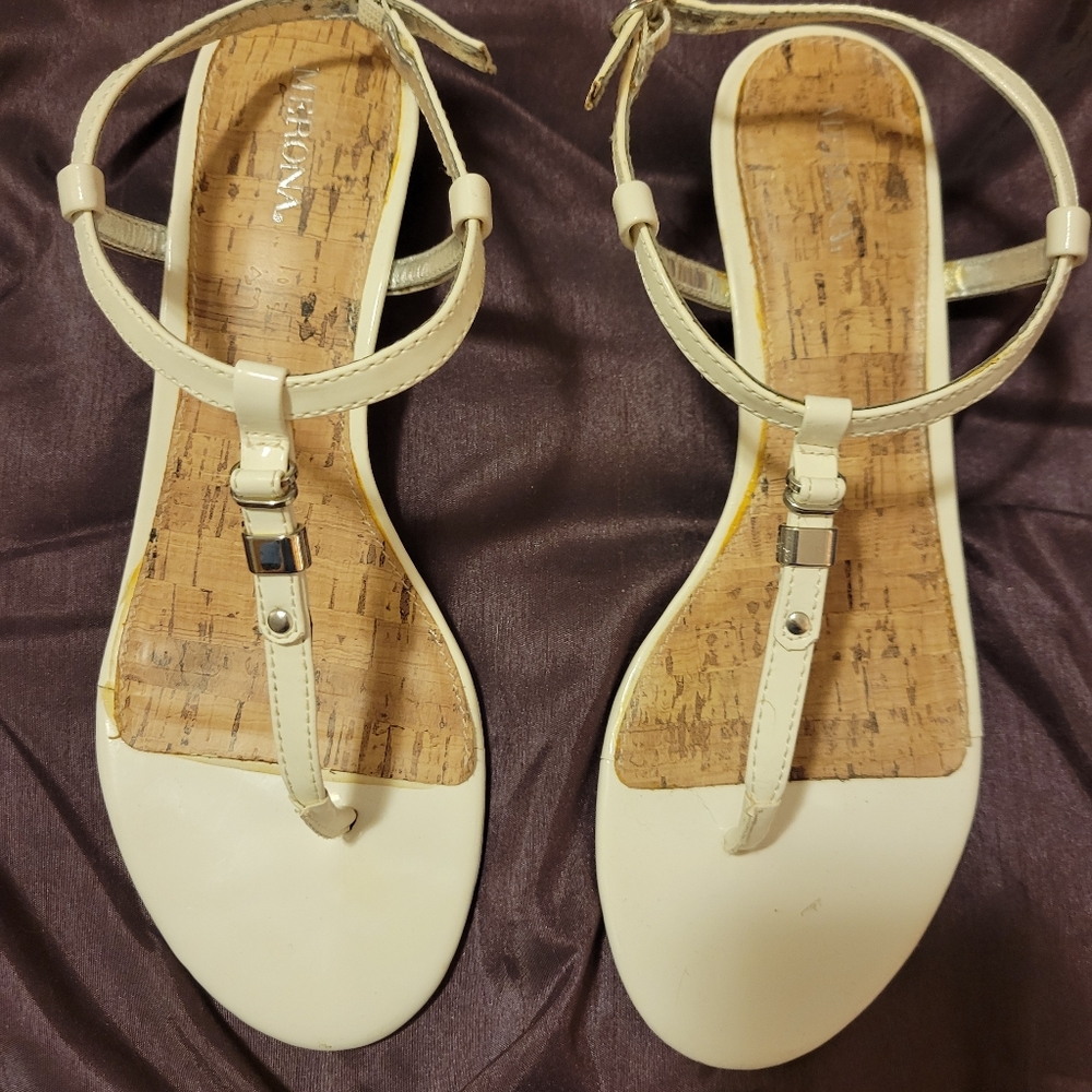 White and tan thongs (sandals)